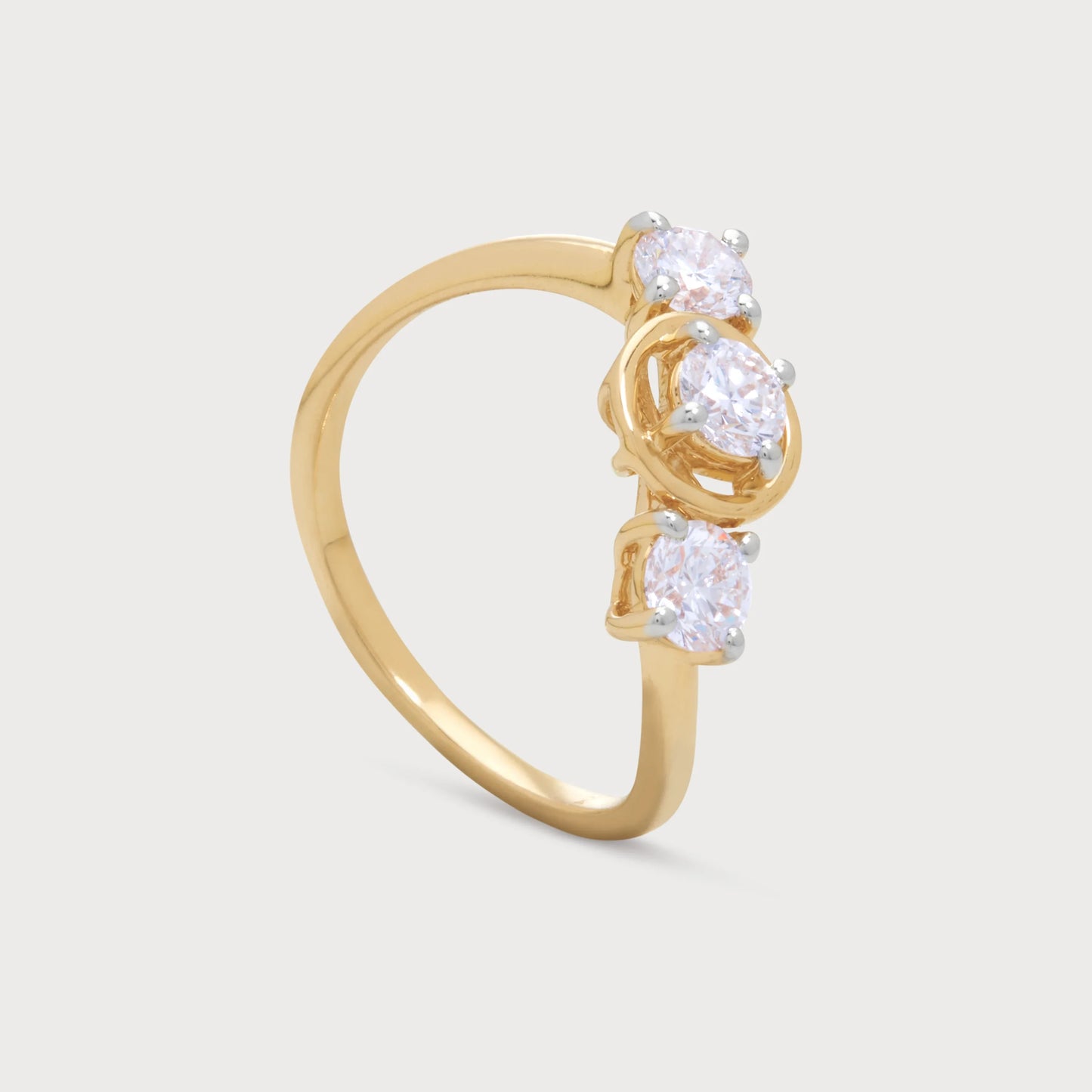 The Alina Ring, an elegant gold diamond three-stone ring featuring three sparkling round brilliant cut diamonds, perfect for engagement or anniversary.