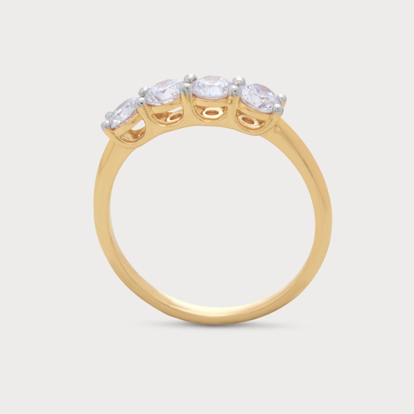 The Zaya Ring, a yellow gold four-stone diamond ring with brilliant round diamonds, perfect for engagement or anniversary, from a fine jewelry ecommerce store.