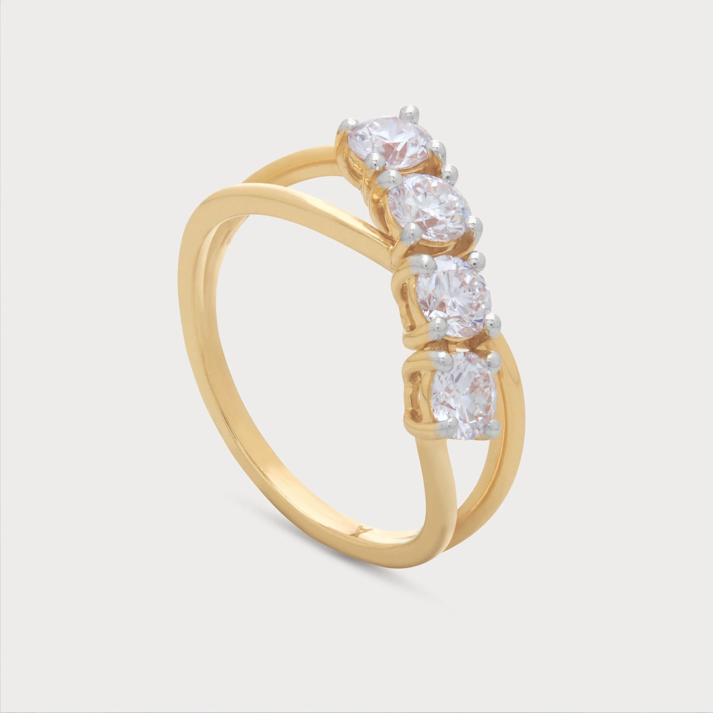 The Arlise Ring: Gold diamond ring featuring four sparkling round brilliant diamonds set in a unique crossover band design. Ideal for engagement, wedding, or anniversary occasions.