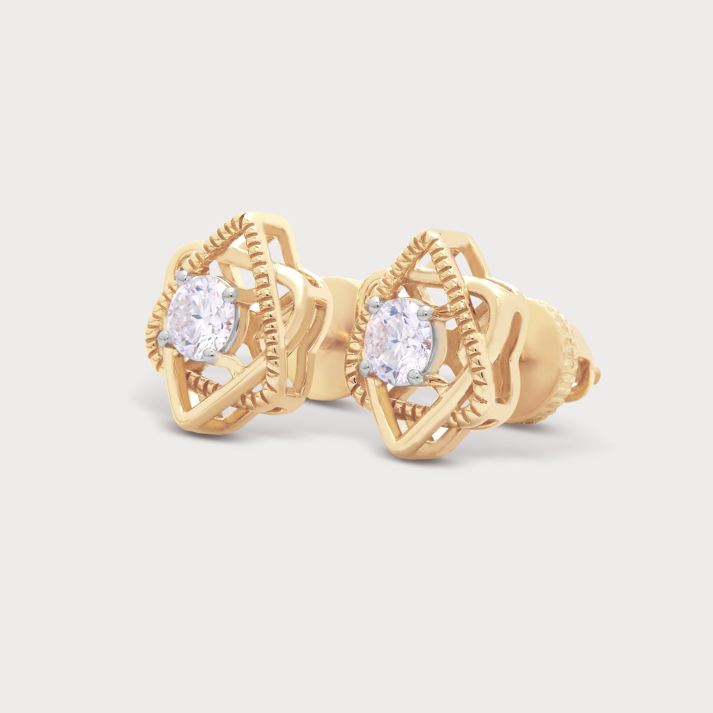 A pair of Gold Star Loop Studs diamond earrings. The elegant gold studs feature a unique loop design surrounding a brilliant round diamond, perfect for diamond jewelry ecommerce.