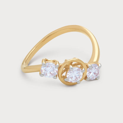 The Alina Ring, a yellow gold ring featuring three brilliant round diamonds. Modern design diamond jewellery for women.