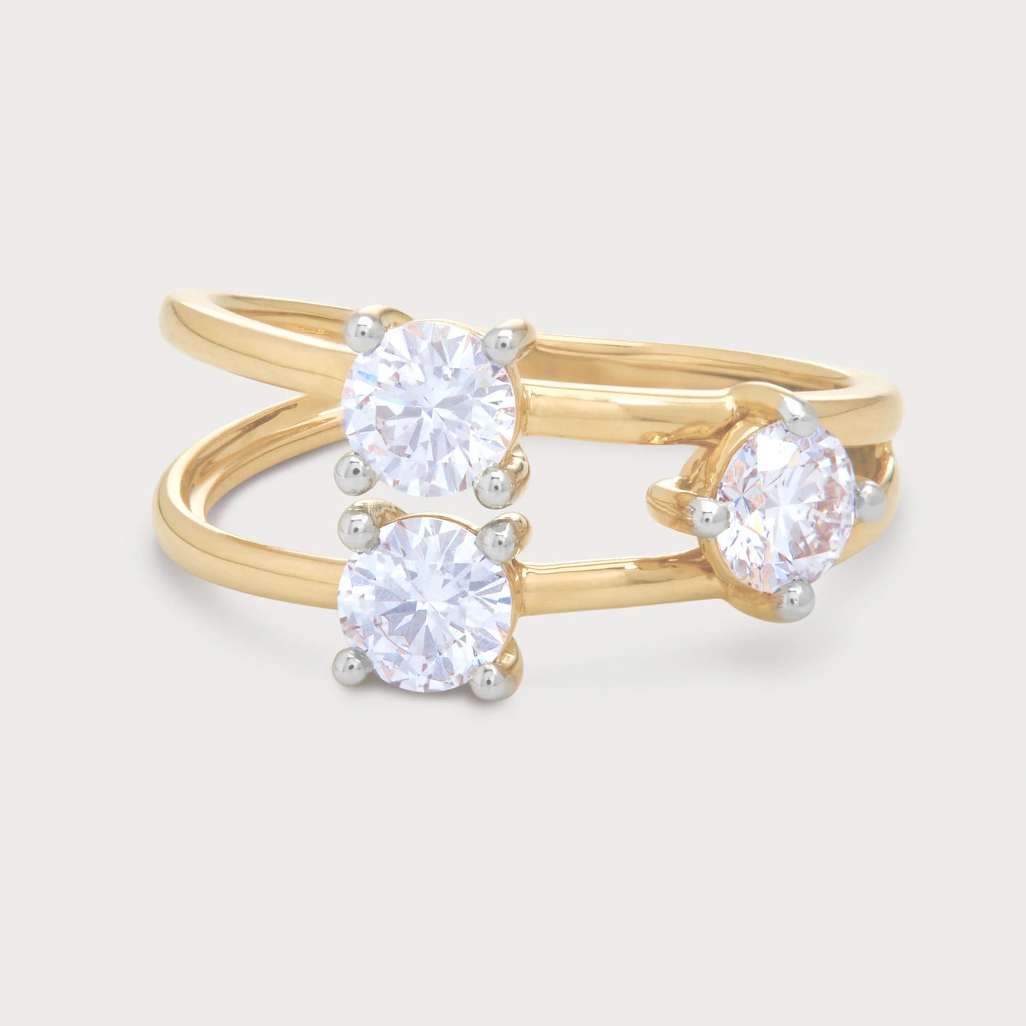The Calista Ring - gold bypass diamond ring with three brilliant cut diamonds, ideal for engagement or a stylish statement piece. Shop fine diamond jewelry.
