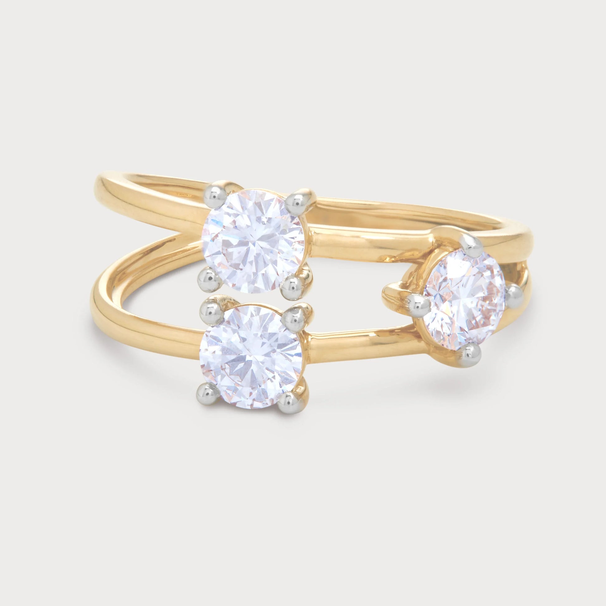 The Calista Ring - gold bypass diamond ring with three brilliant cut diamonds, ideal for engagement or a stylish statement piece. Shop fine diamond jewelry.