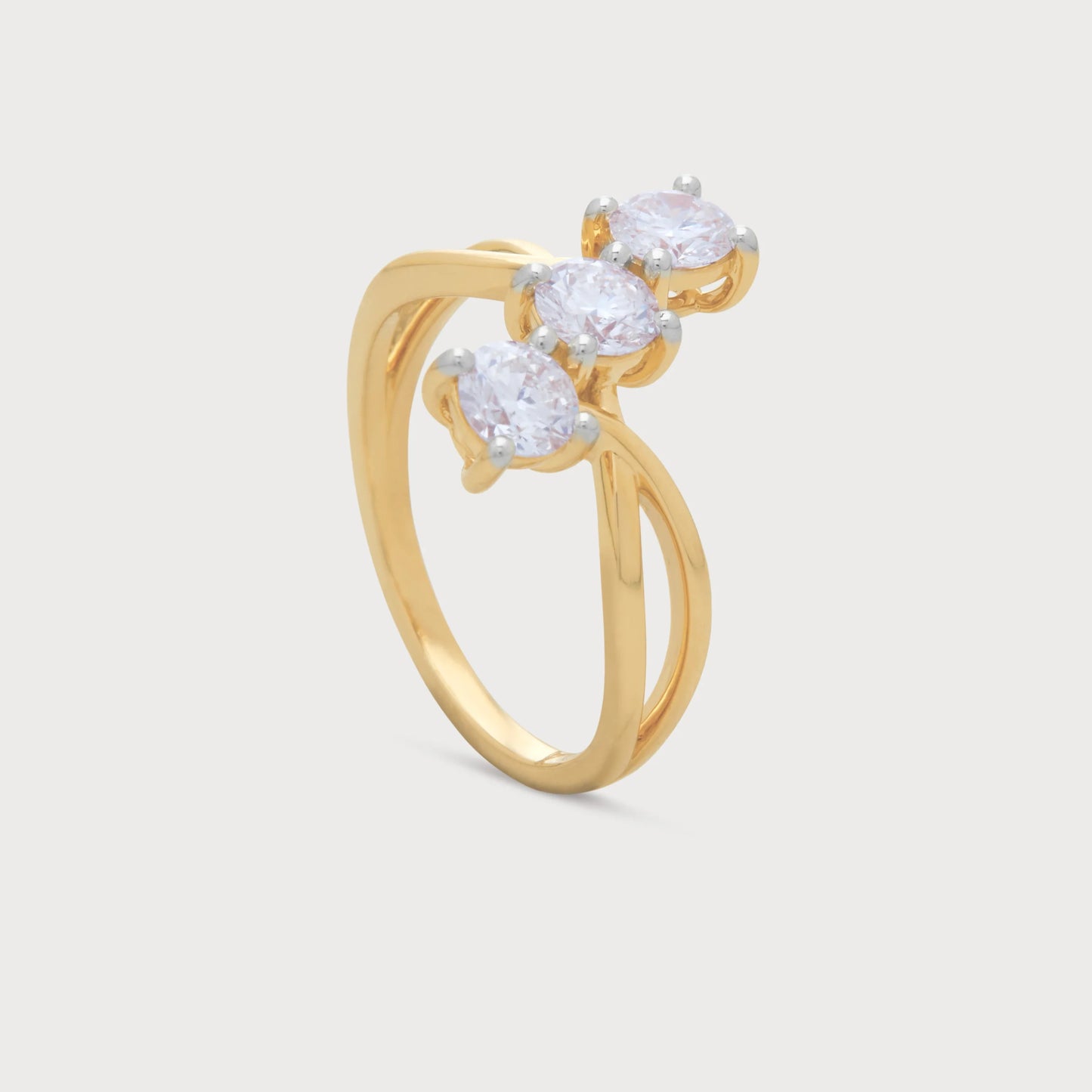 The Trinity Twist Ring: A gold ring featuring a twisted band with three sparkling round diamonds, ideal for diamond jewelry ecommerce.