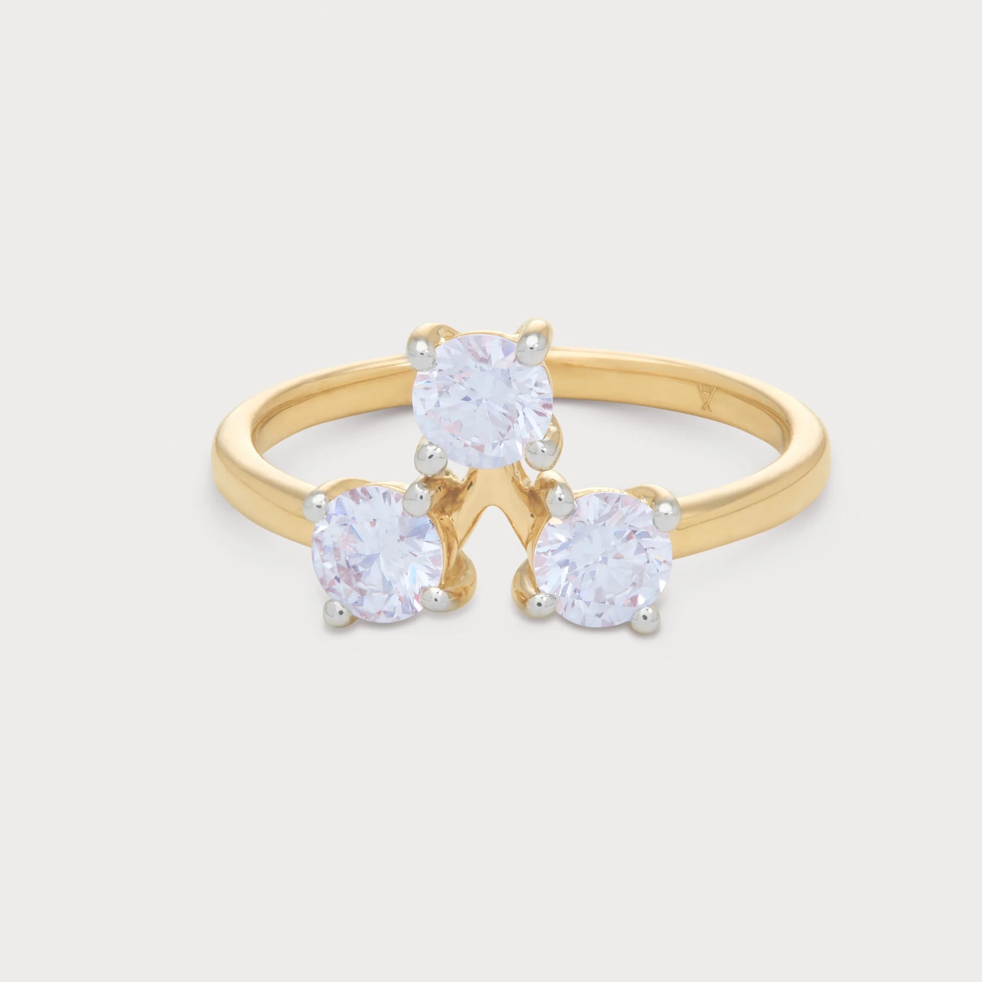 The Solis Ring: A stunning yellow gold diamond ring featuring three brilliant round diamonds, perfect for elegant diamond jewelry collections.