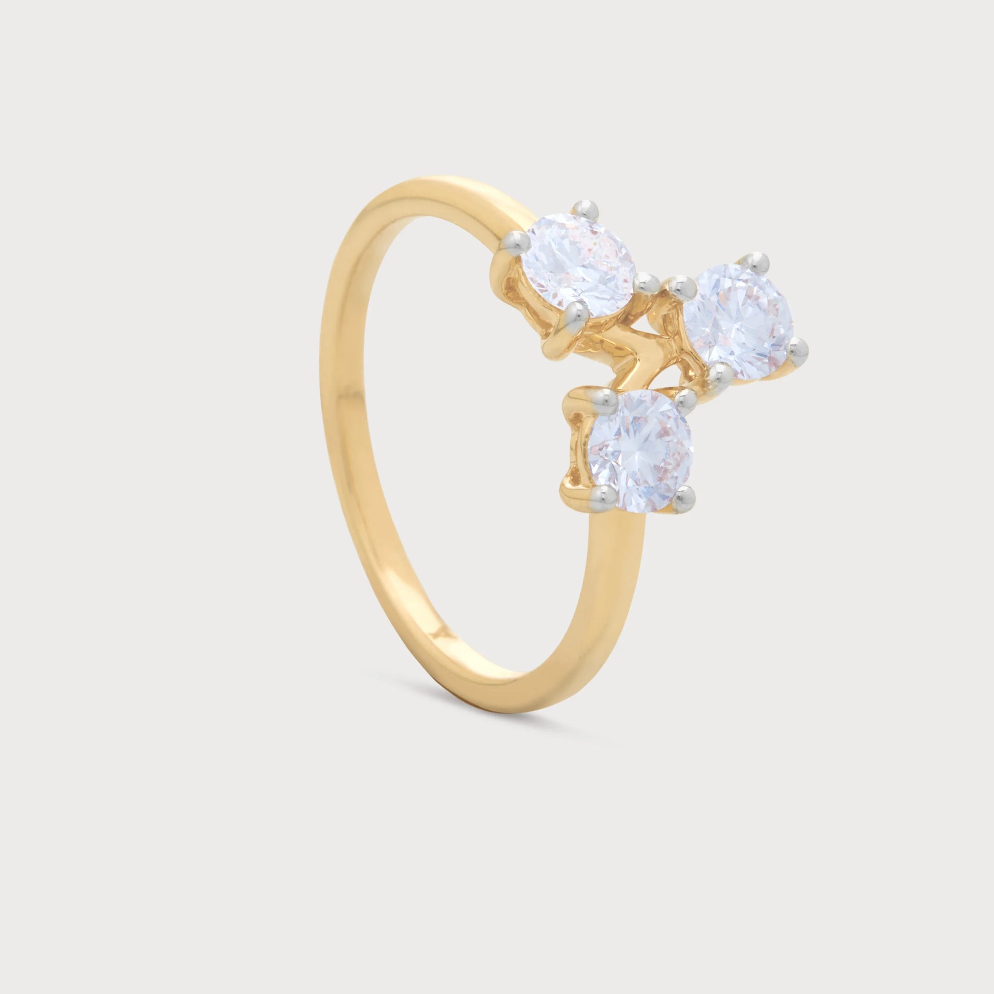 The Solis Ring: Elegant gold three-stone diamond ring featuring brilliant round-cut diamonds, perfect for women's fine jewelry and special occasions.