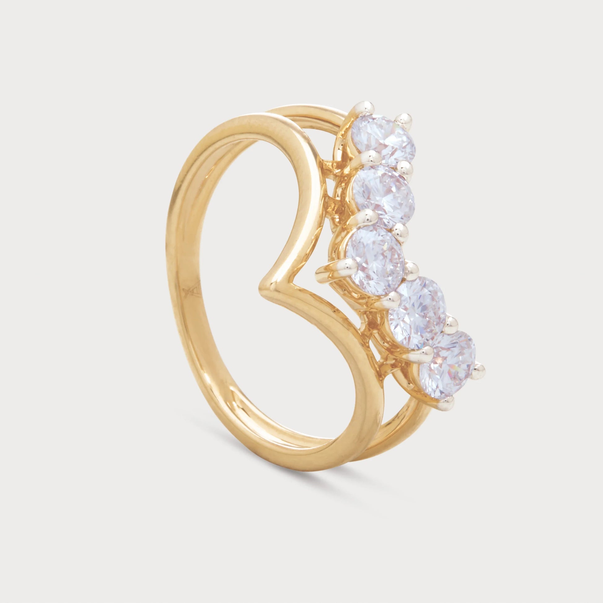The Avienne Ring, a beautiful yellow gold ring featuring five brilliant round diamonds set on a unique curved band, perfect for diamond jewellery ecommerce.