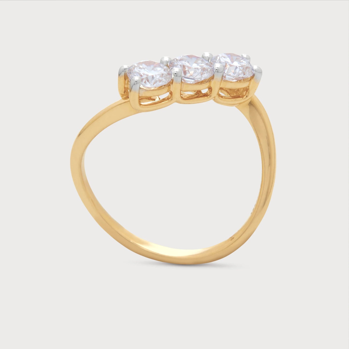The Samara Ring: Gold three-stone diamond ring. Elegant fine jewelry featuring three brilliant round diamonds, ideal for engagement or anniversary.