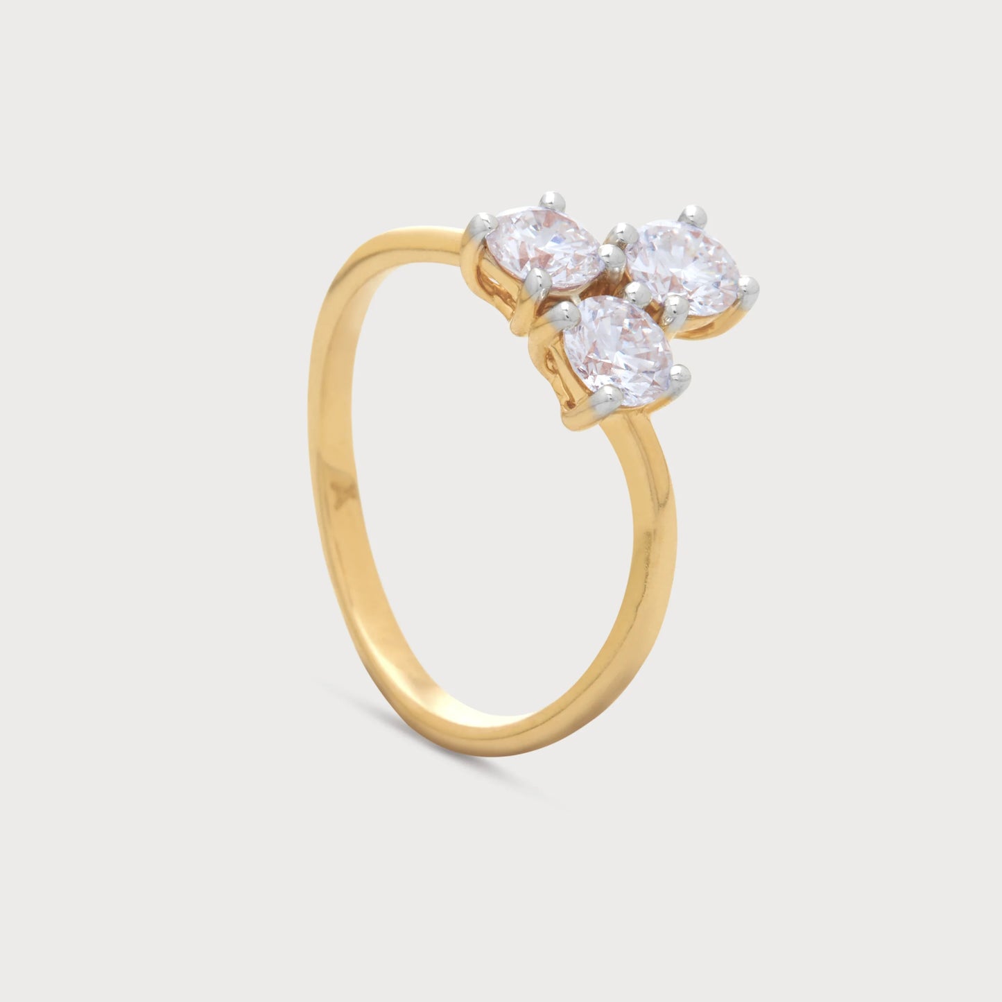 The Arvia Bloom Ring, a stunning gold diamond ring featuring three sparkling diamonds in a bloom-inspired design. Perfect for engagement, anniversary, or a special gift. Shop diamond jewellery online.