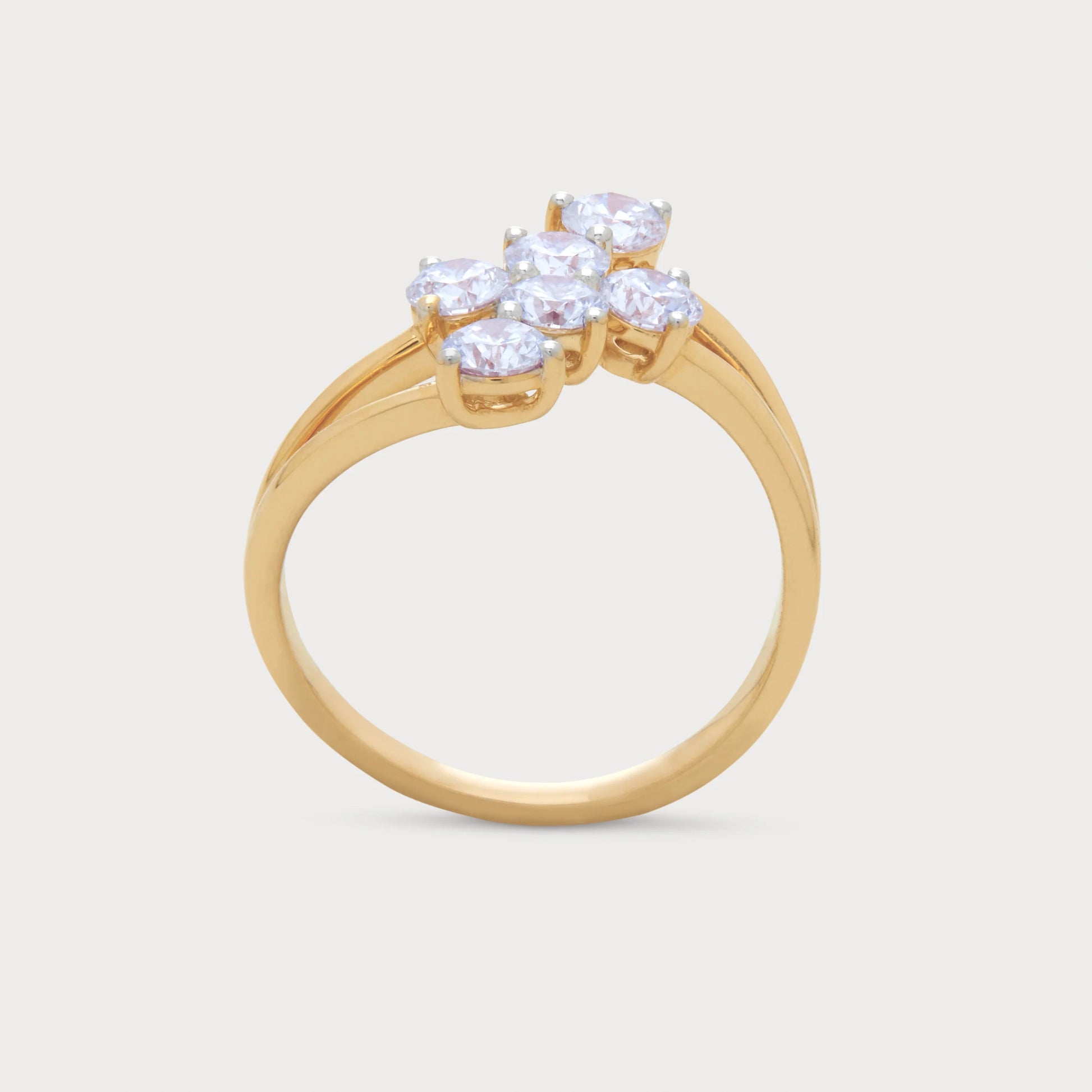 The Asteris Ring: Yellow gold cluster ring with multiple round brilliant diamonds.