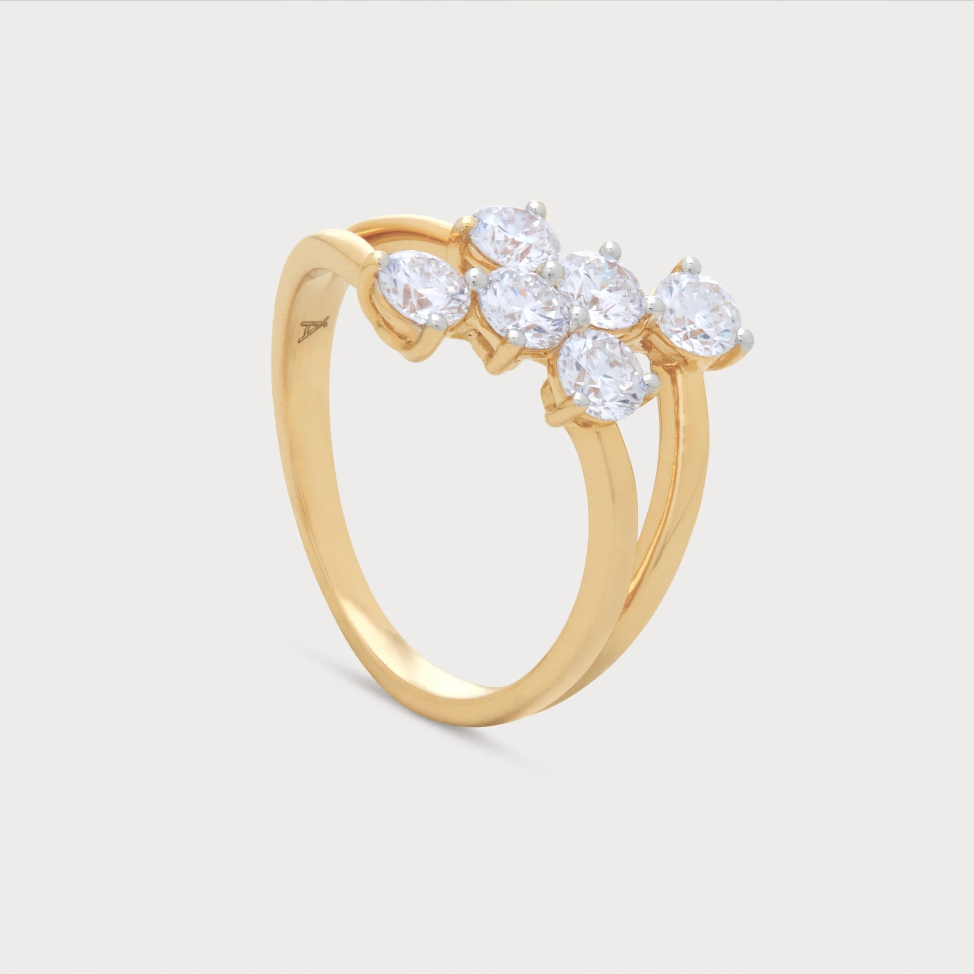 The Asteris Ring, an elegant gold diamond cluster ring featuring a unique band design with brilliant round diamonds, ideal for women's fine jewelry.