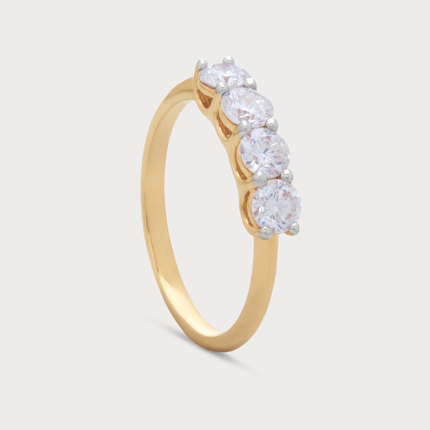 The Zaya Ring, a stunning gold diamond ring featuring four sparkling round diamonds. Perfect for engagement, wedding, or anniversary.