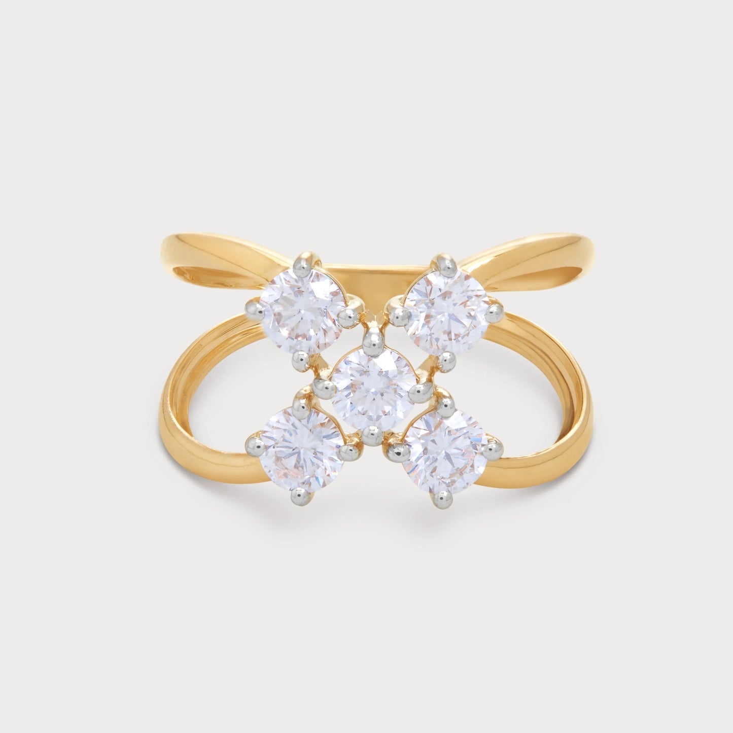 The Calyx Ring, an 18k yellow gold diamond ring for women, featuring five brilliant round diamonds in a floral cluster design on a stylish criss-cross band. Ideal for fine jewelry and special occasions.