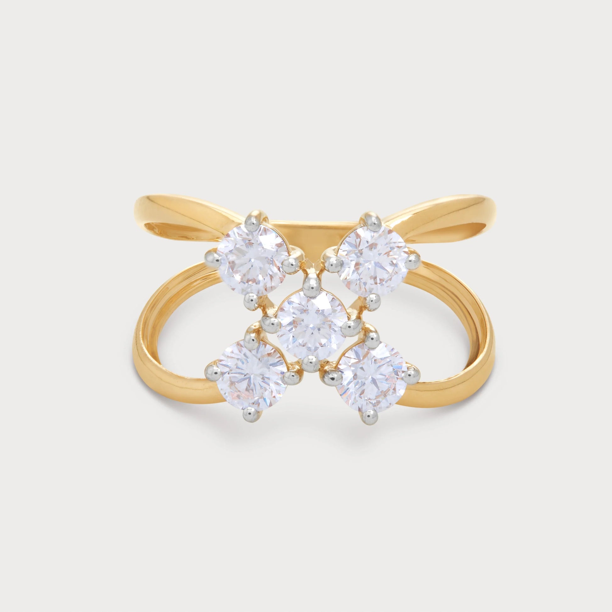 The Calyx Ring, an 18k yellow gold diamond ring for women, featuring five brilliant round diamonds in a floral cluster design on a stylish criss-cross band. Ideal for fine jewelry and special occasions.