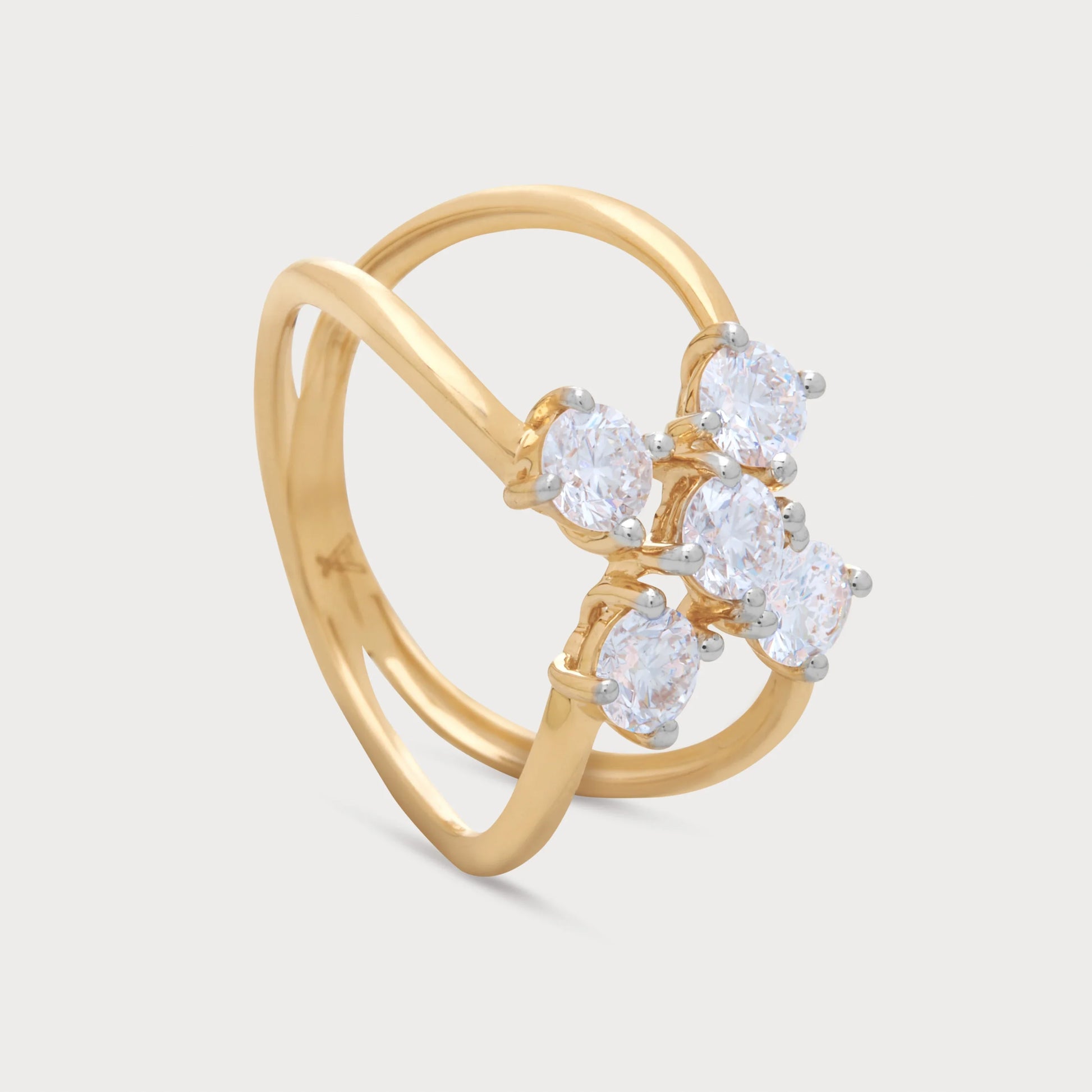 The Calyx Ring, a stunning yellow gold diamond ring featuring a unique double band design and five brilliant-cut round diamonds arranged in a modern floral cluster. Ideal as a luxury engagement ring, anniversary gift, or statement fine jewelry for women.