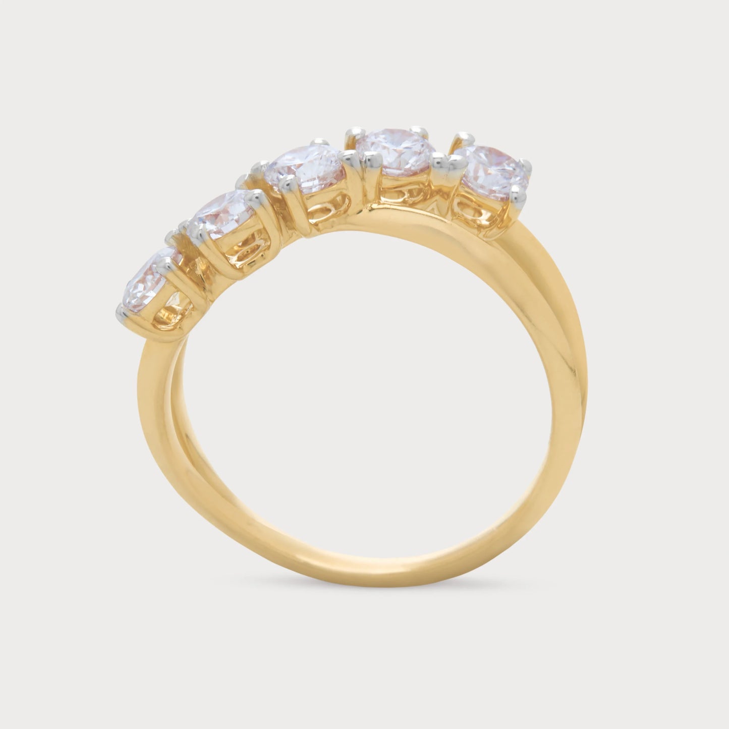 The Alouette Ring: A five-stone gold diamond ring featuring brilliant round diamonds elegantly set in a unique curved design, ideal for women's fine jewelry.