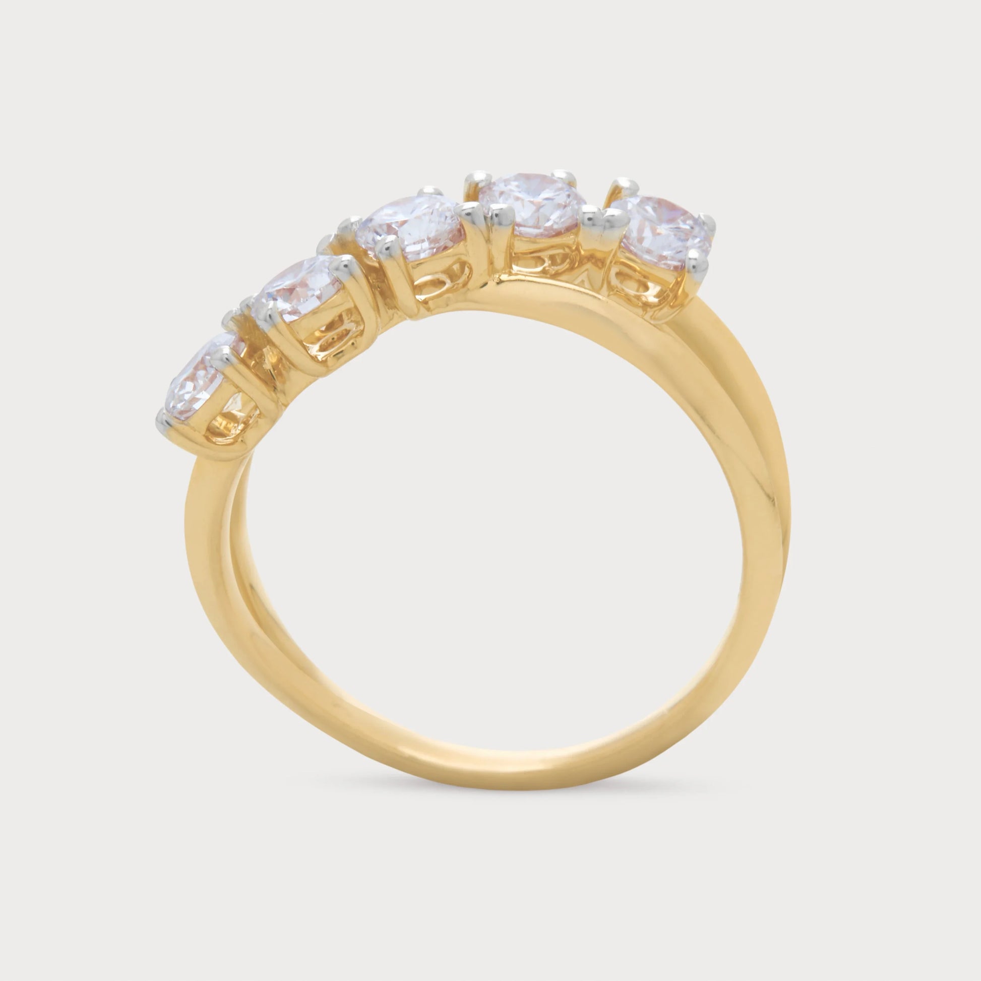 The Alouette Ring: A five-stone gold diamond ring featuring brilliant round diamonds elegantly set in a unique curved design, ideal for women's fine jewelry.