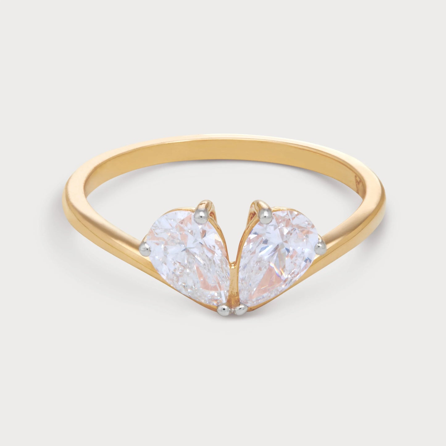 The Zephra Ring: Gold diamond ring with two pear-shaped diamonds. Shop luxury diamond jewellery online.