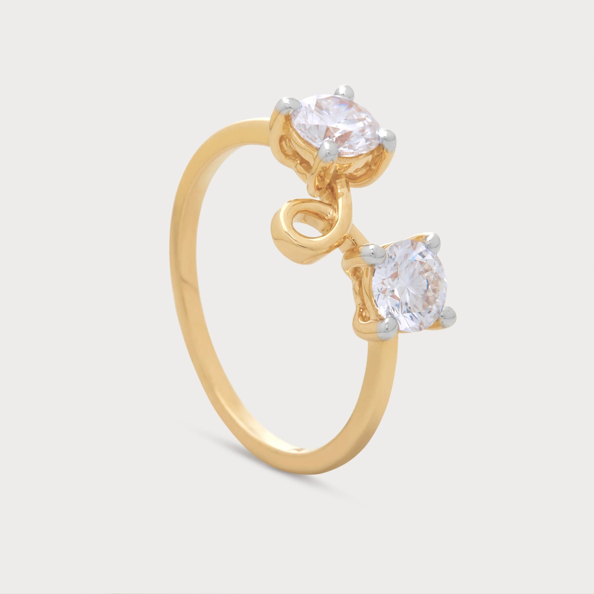 The Caia Ring gold open two-stone diamond ring with a unique swirl design.