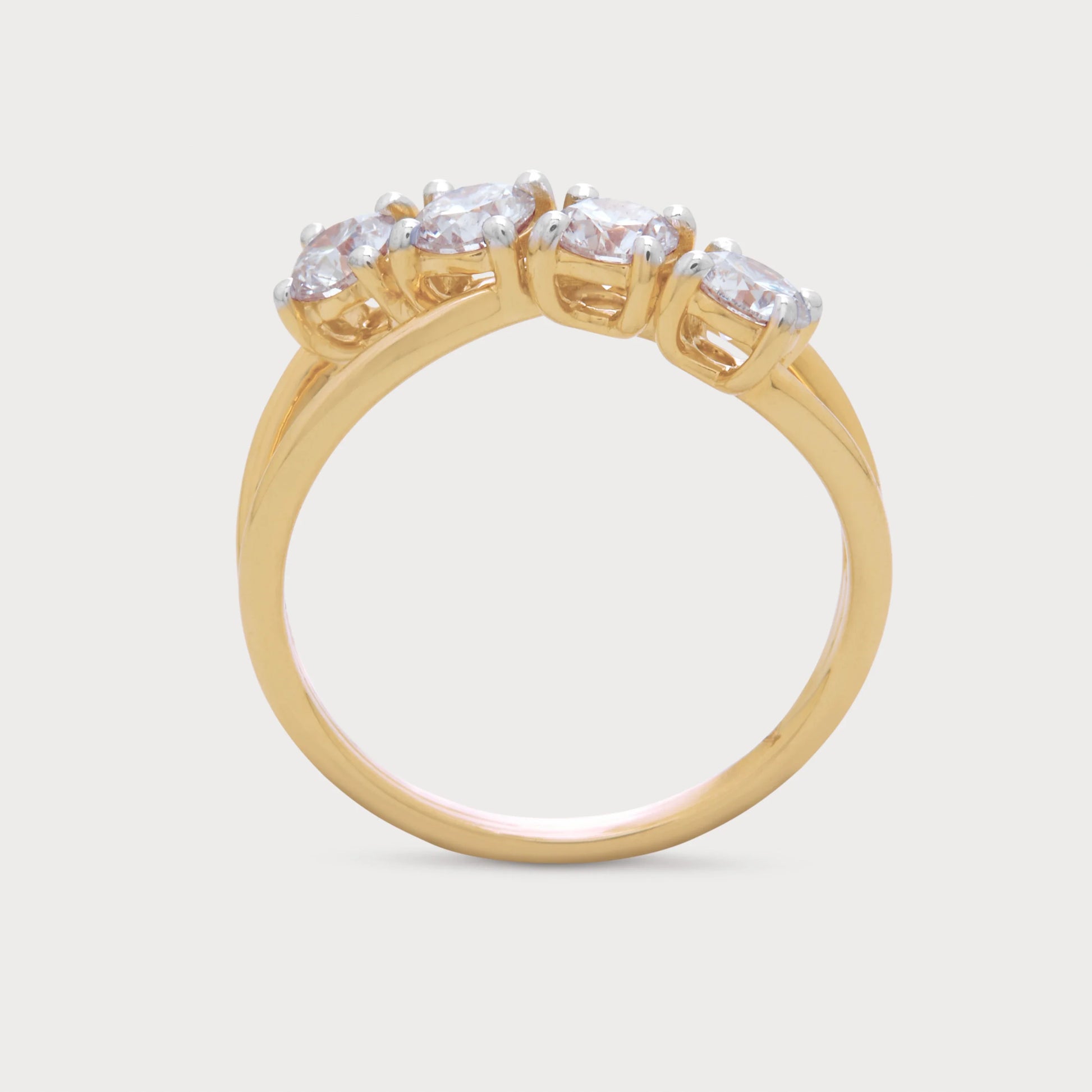 The Arlise Ring: Yellow gold diamond ring with four round brilliant cut diamonds set on a stylish crossover band. Fine diamond jewellery for engagement and anniversary.