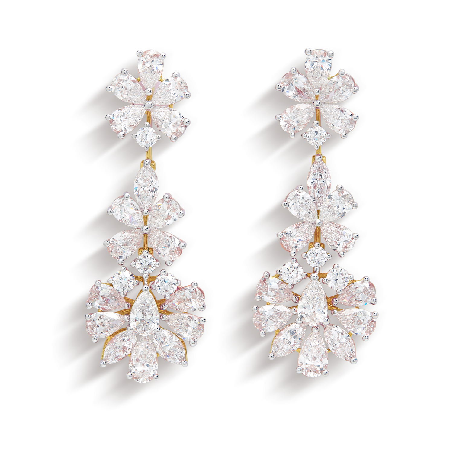 The Ophelia Long Earrings. Luxurious diamond dangle earrings featuring pear-shaped and round brilliant diamonds in an elegant floral cluster design, set in gold. Fine jewelry for women.