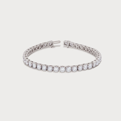 The Grand Tennis Bracelet featuring brilliant-cut diamonds set in a white gold or platinum band, perfect for a luxurious diamond jewelry gift or elegant accessory.