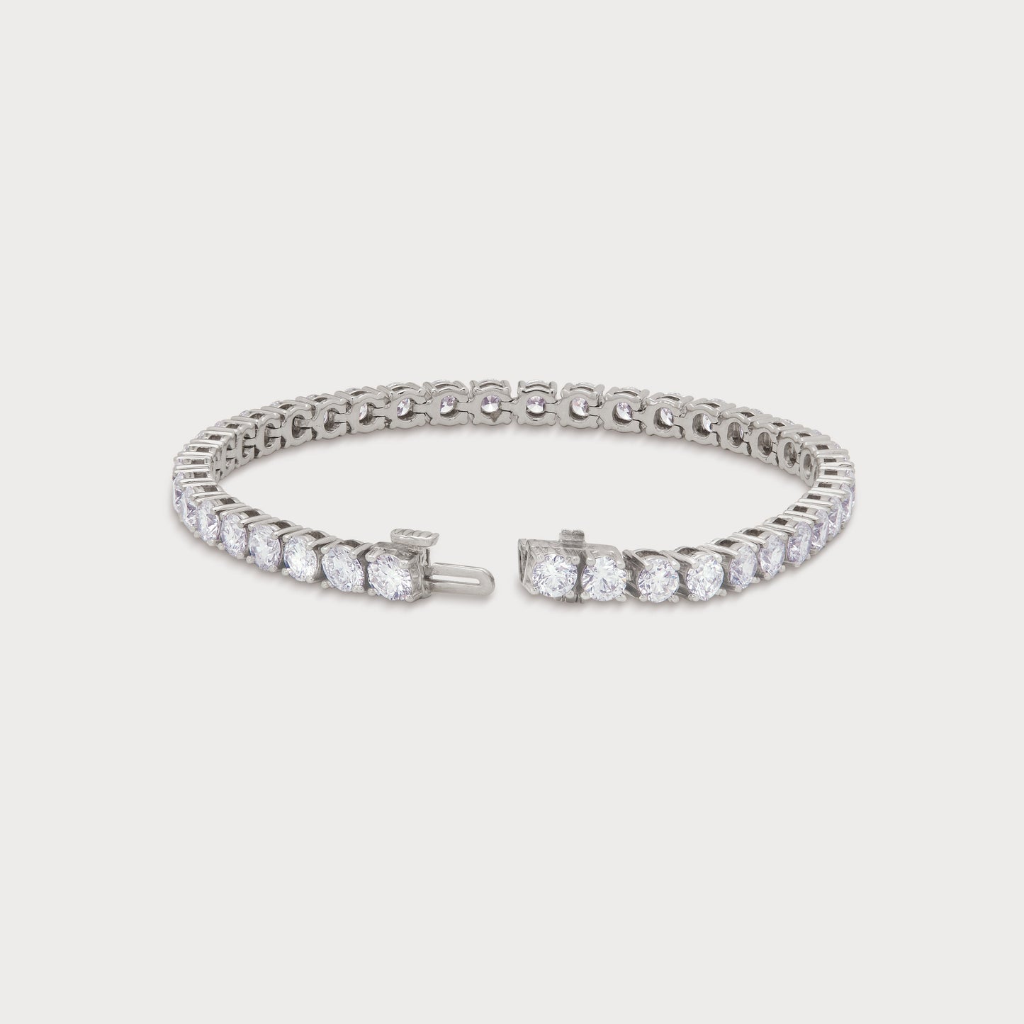The Grand Tennis Bracelet in white gold, featuring a continuous line of brilliant-cut diamonds, perfect for luxury diamond jewelry ecommerce SEO.