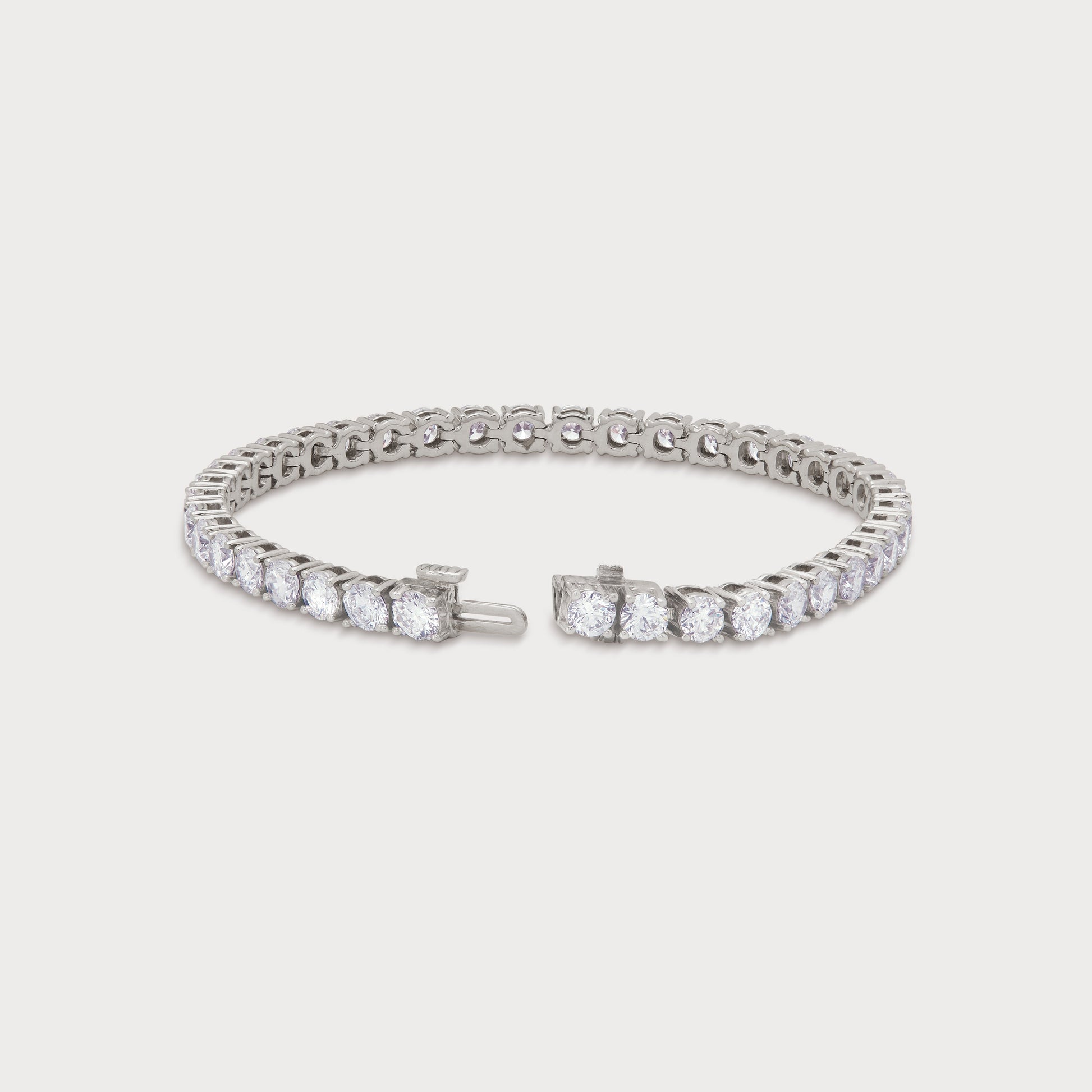 The Grand Tennis Bracelet in white gold, featuring a continuous line of brilliant-cut diamonds, perfect for luxury diamond jewelry ecommerce SEO.