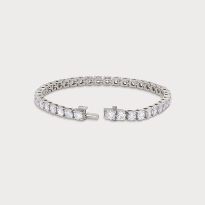 The Grand Tennis Bracelet in white gold, featuring a continuous line of brilliant-cut diamonds, perfect for luxury diamond jewelry ecommerce SEO.