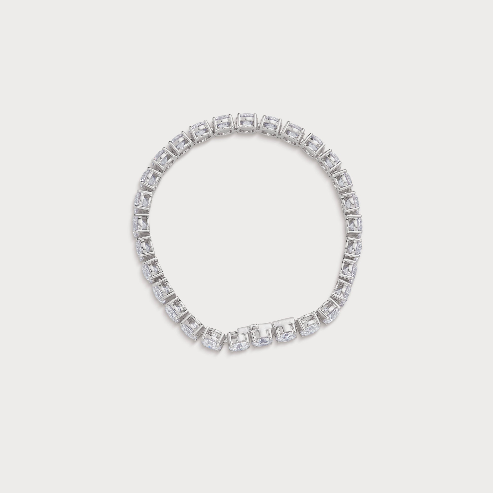 The Regal Tennis Bracelet, an exquisite white gold diamond tennis bracelet with brilliant round diamonds, perfect for luxury fine jewelry lovers. Shop now at our diamond jewelry ecommerce store.