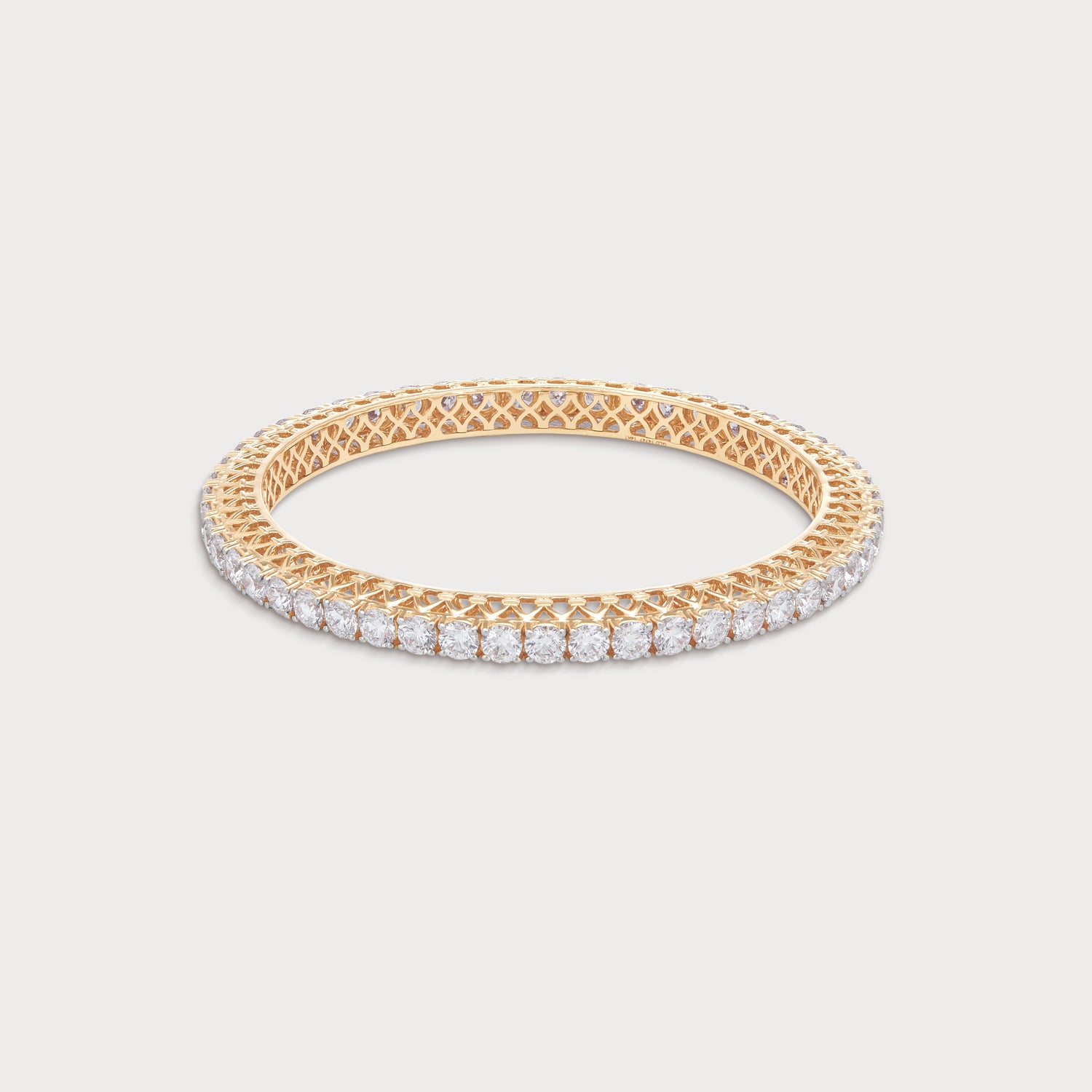 The Classic Bangle: Luxurious gold diamond bangle bracelet featuring brilliant round cut diamonds and intricate gold detailing. Perfect fine diamond jewelry for women.
