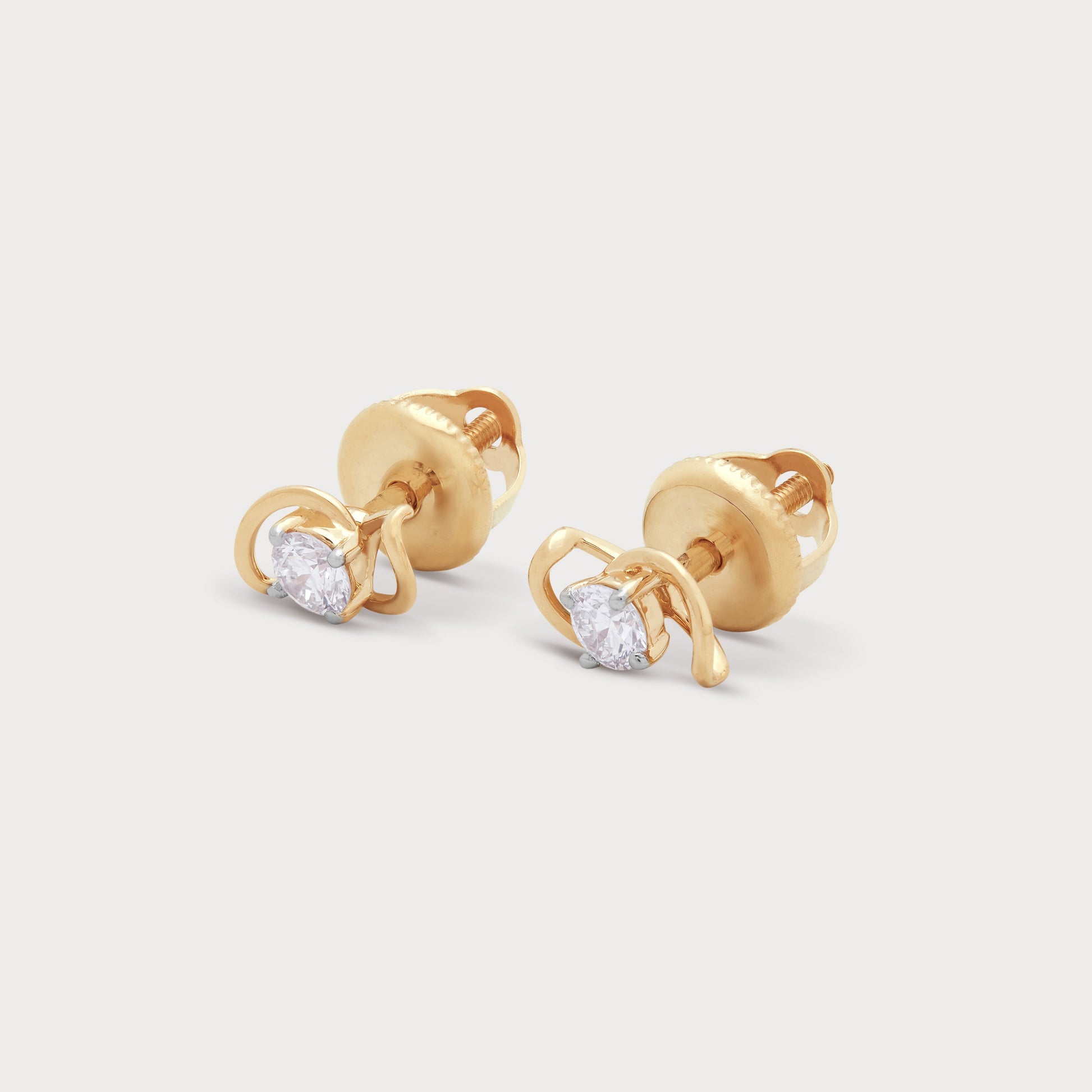 The Creation Studs diamond earrings in yellow gold. Elegant diamond stud earrings for women from our exclusive jewellery collection.