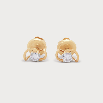 The Creation Studs gold diamond earrings. Elegant stud earrings with brilliant diamonds for women's jewellery.