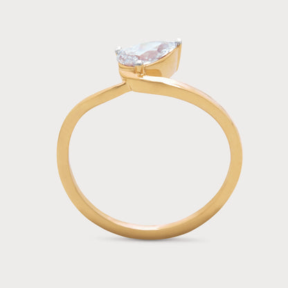 The Serelis Ring, a stunning yellow gold diamond ring featuring a brilliant pear-cut solitaire diamond, ideal for engagement or a luxurious gift.