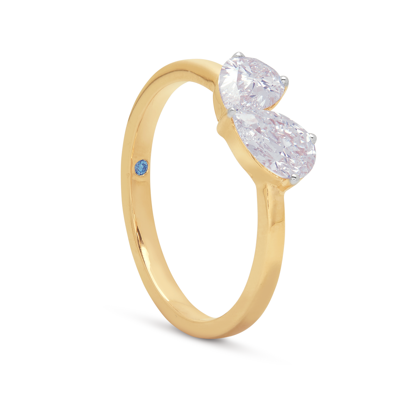 Twin Pear Diamond Ring in gold, featuring two pear-shaped diamonds and a blue sapphire accent, ideal for engagement or fine jewelry.