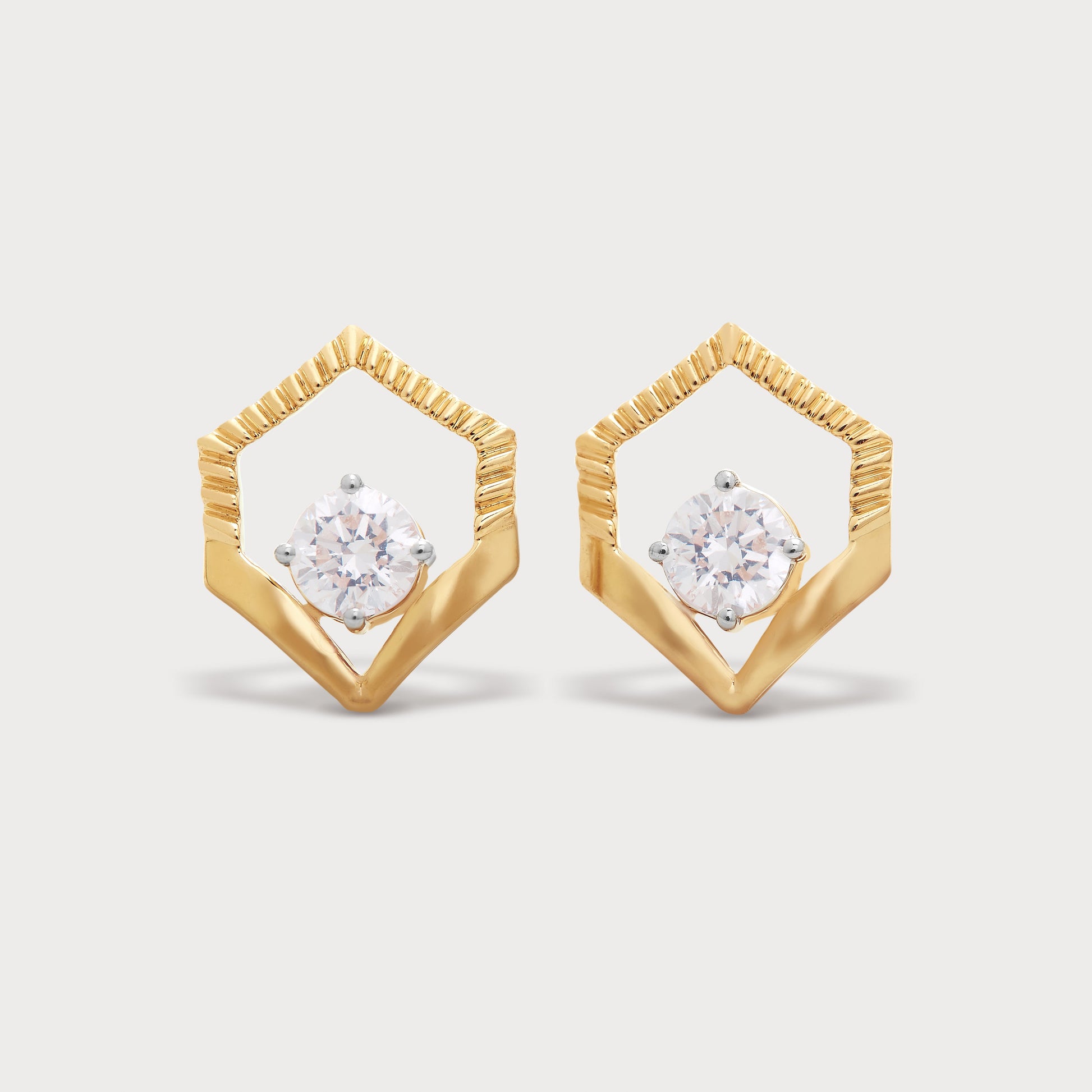 The Archway Studs gold diamond earrings. Elegant hexagonal geometric design stud earrings with sparkling round diamonds, ideal for luxury fine jewelry collections.