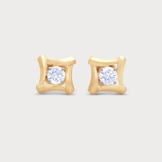 The Meteor Studs: Yellow gold diamond stud earrings with a unique curved setting, perfect for diamond jewelry collections.