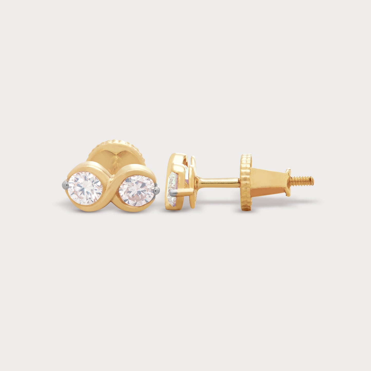 The Binolo Studs gold diamond earrings, featuring two brilliant round diamonds set in a captivating, intertwined gold design. Perfect for everyday elegance or a special gift from our diamond jewelry collection.