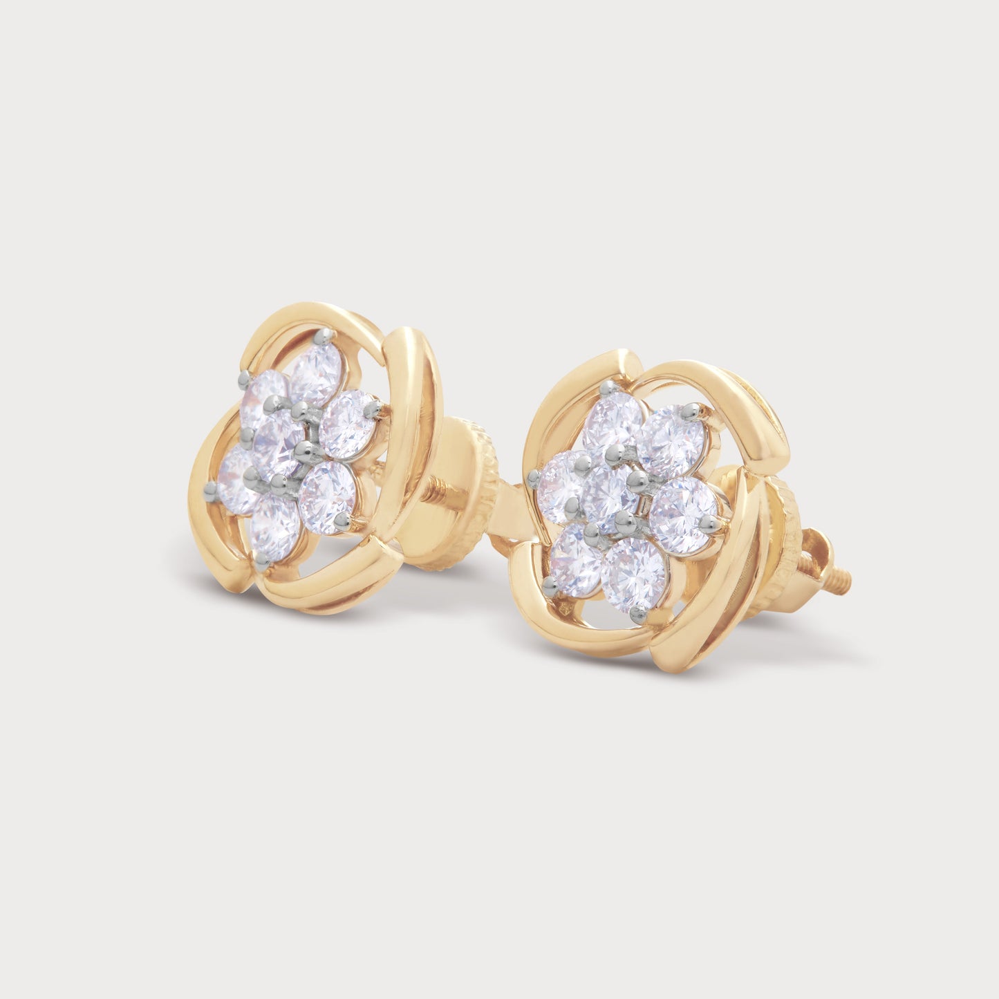 The Chakra Flower Studs, elegant gold diamond floral stud earrings featuring multiple brilliant diamonds, ideal for an e-commerce diamond jewelry store.