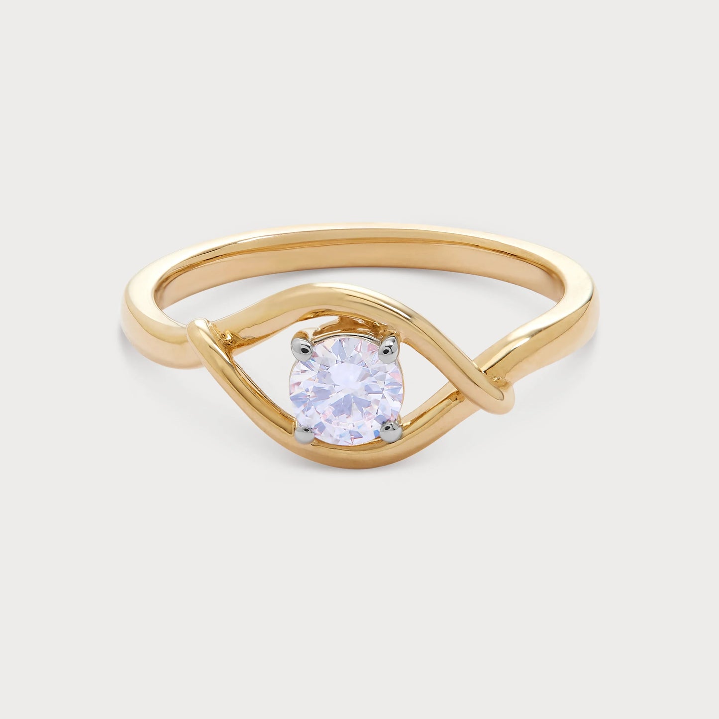 The Enso Ring: Gold diamond solitaire ring with a unique twisted band design.