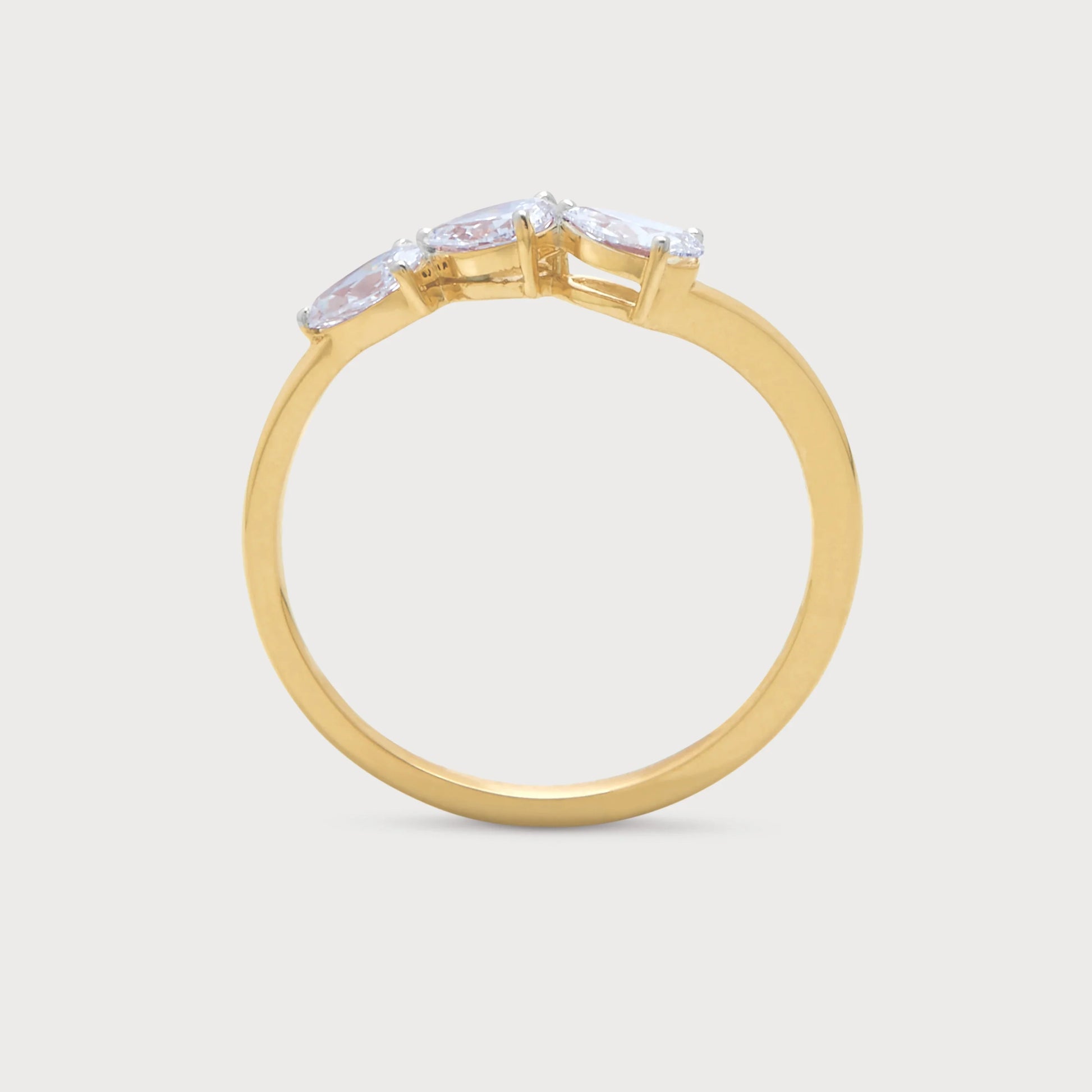 The Radiant Ring: Gold diamond ring featuring three brilliant marquise-cut diamonds. Perfect for an engagement, anniversary, or as fine diamond jewelry.