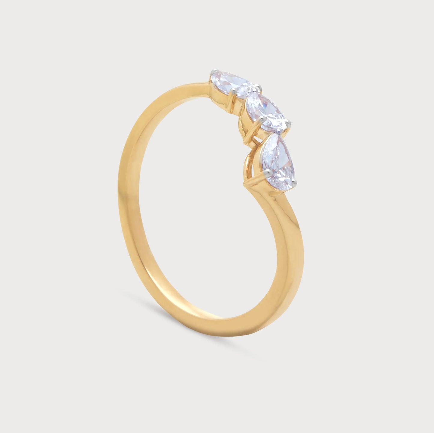 The Radiant Ring: Stunning gold ring featuring three dazzling pear-shaped diamonds, perfect for engagement, wedding, or anniversary from our fine diamond jewelry collection.