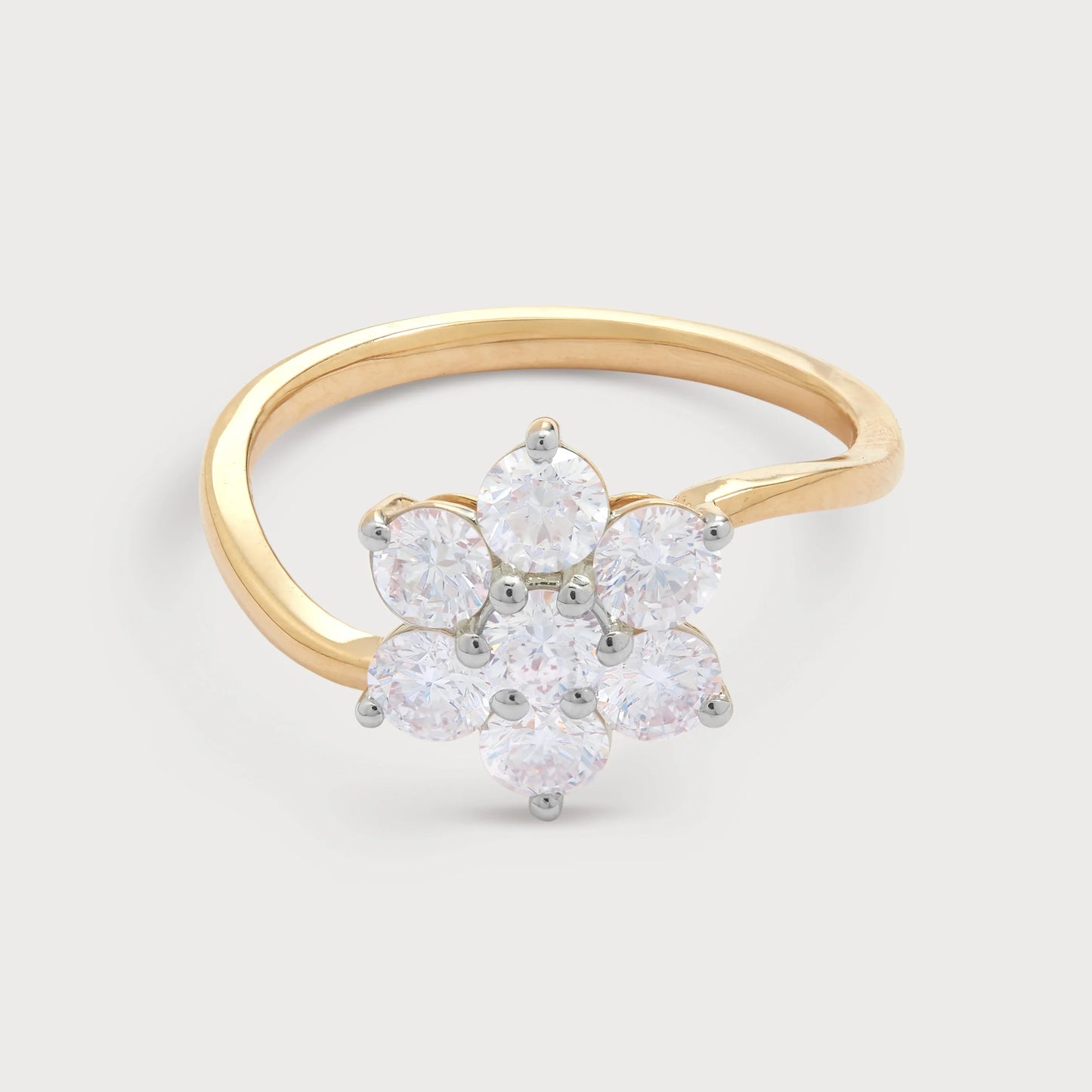 The Bloom Ring: Elegant gold diamond ring featuring a seven-stone floral cluster design, perfect for engagements or as a statement fashion ring.