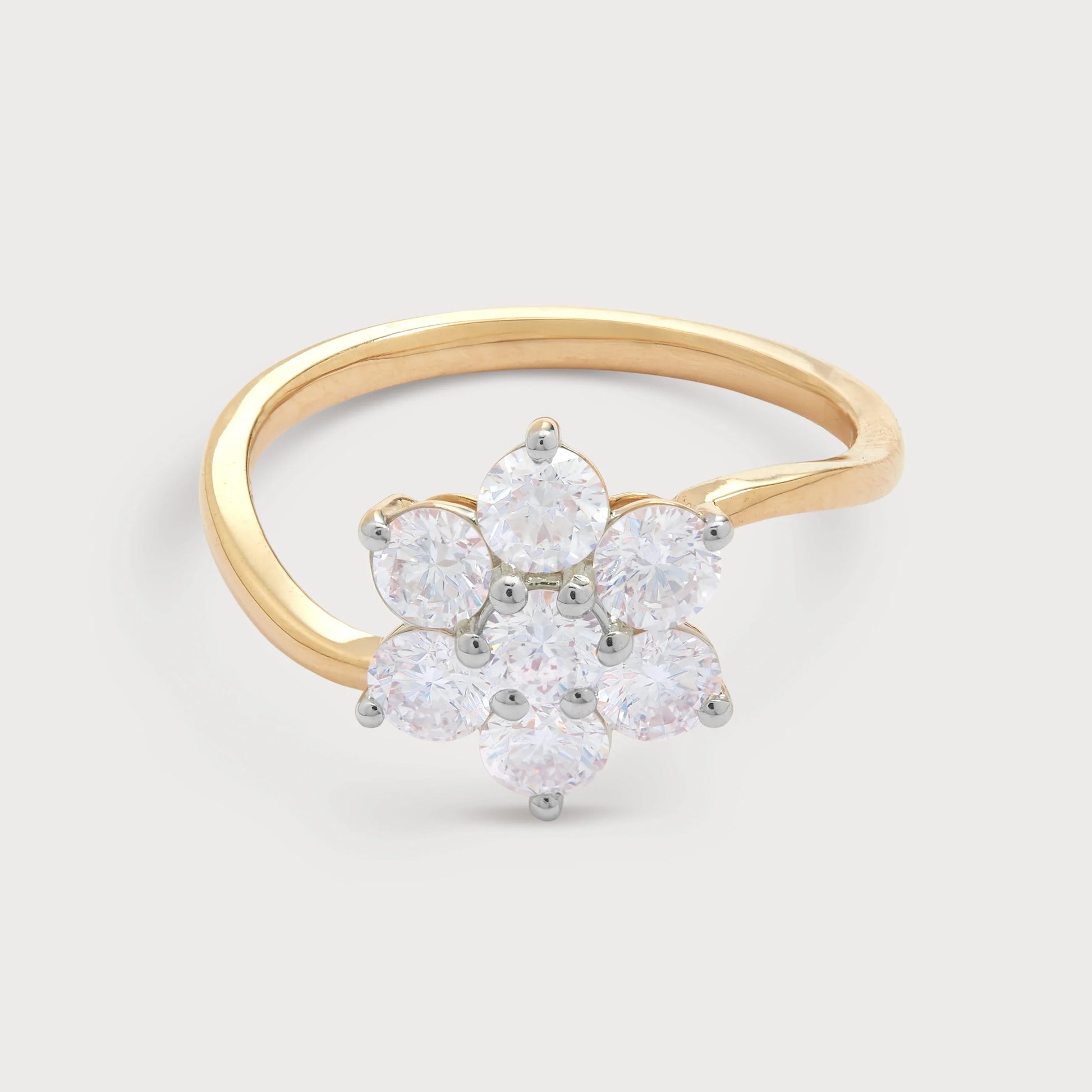 The Bloom Ring: Elegant gold diamond ring featuring a seven-stone floral cluster design, perfect for engagements or as a statement fashion ring.