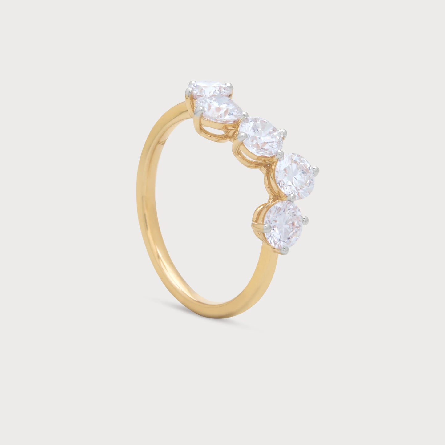 The Aster Ring: A stunning yellow gold diamond ring featuring five brilliant round diamonds, perfect for engagement, wedding, or as elegant fine jewelry.
