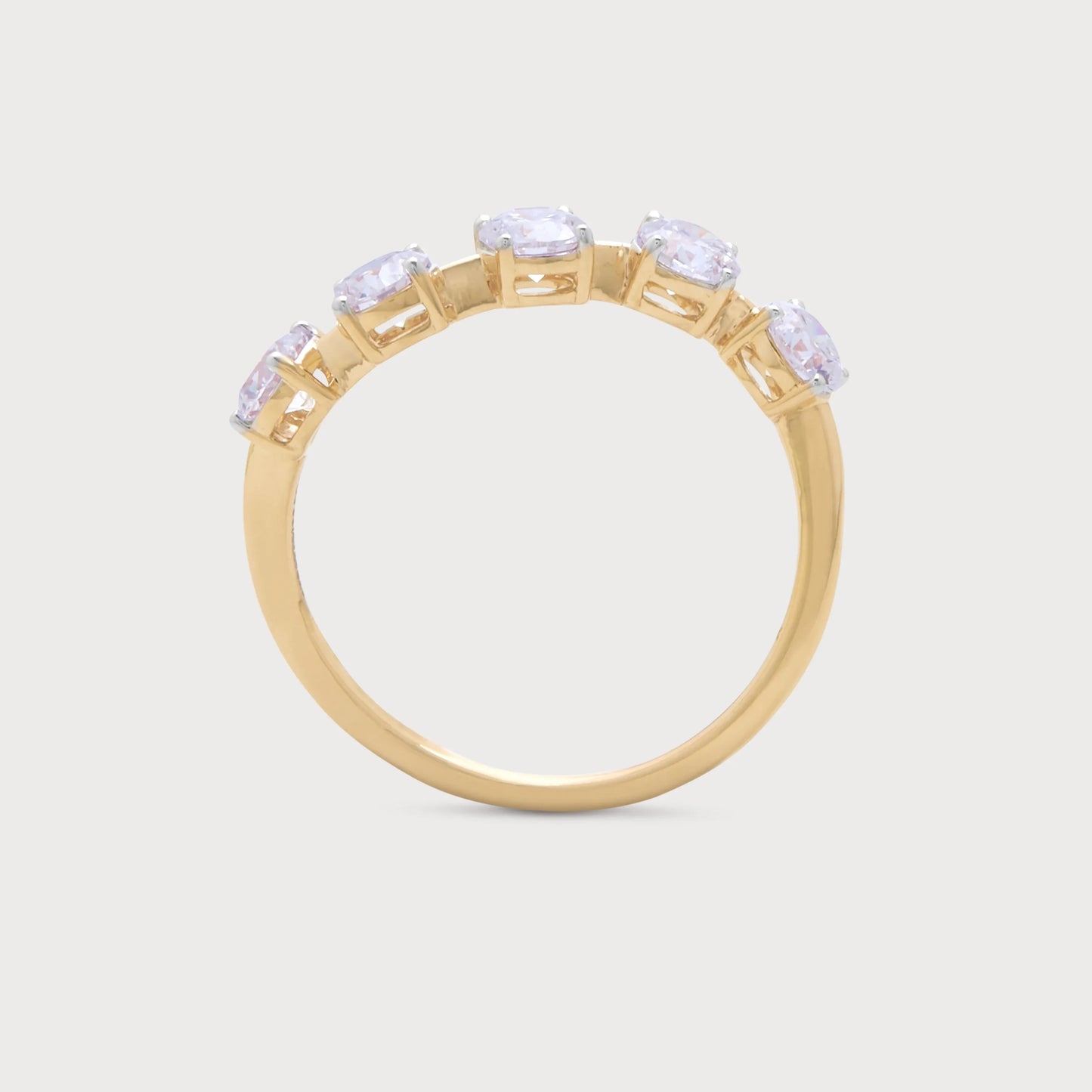 The Vela Ring: Elegant gold diamond ring featuring five sparkling oval diamonds.