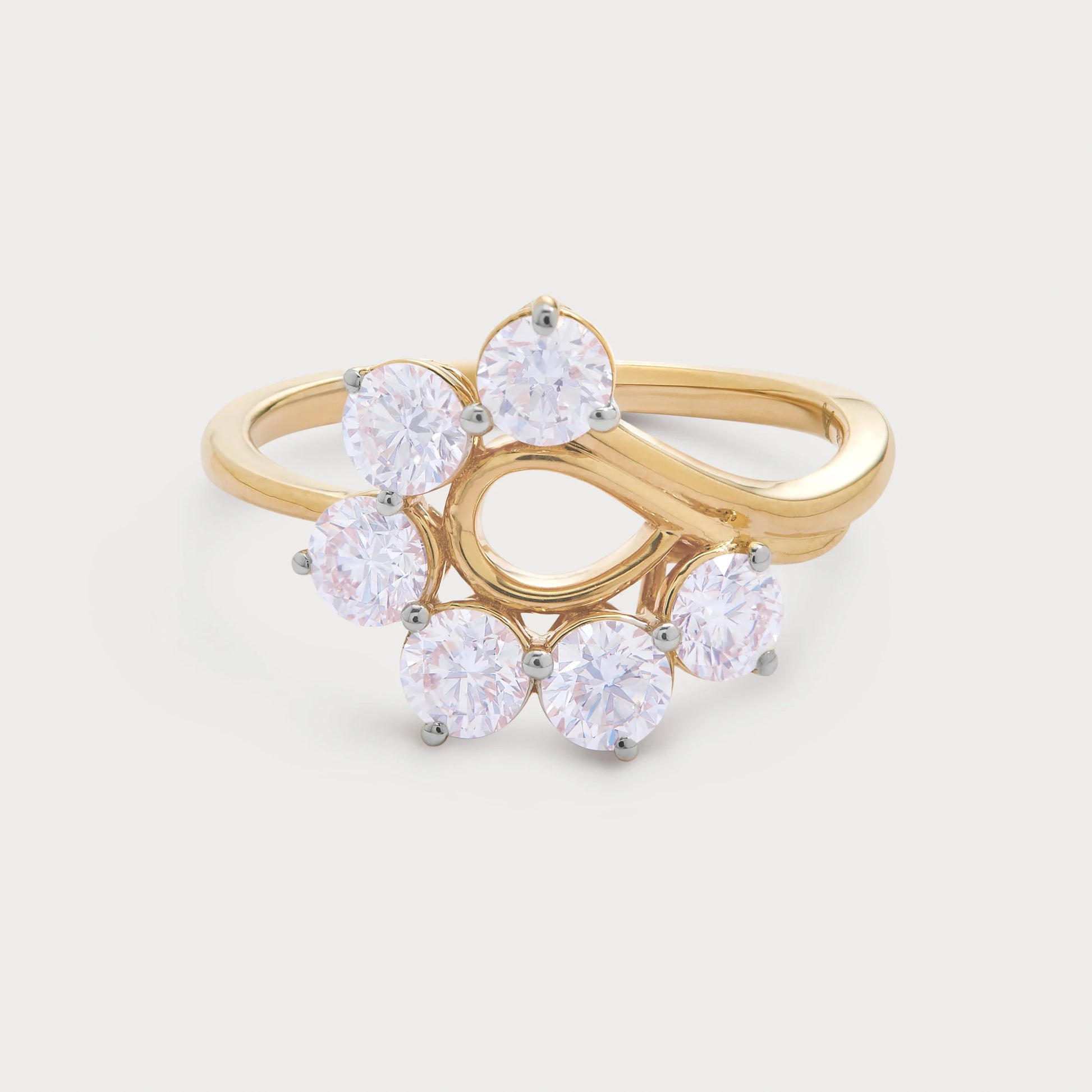 The Althea Ring, a stunning gold diamond ring featuring multiple round diamonds set in a unique cluster design, perfect for an engagement or special occasion. Fine diamond jewelry.