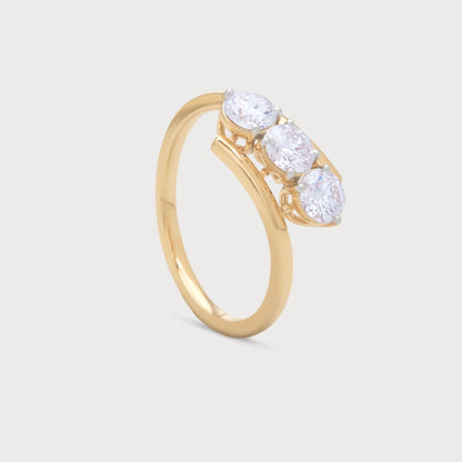 The Selara Ring: Gold three-stone diamond ring with round brilliant diamonds, ideal for engagement or anniversary.
