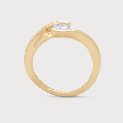 The Enfold Ring - a yellow gold diamond solitaire ring with a unique bypass setting, ideal for engagement or as fine diamond jewelry.