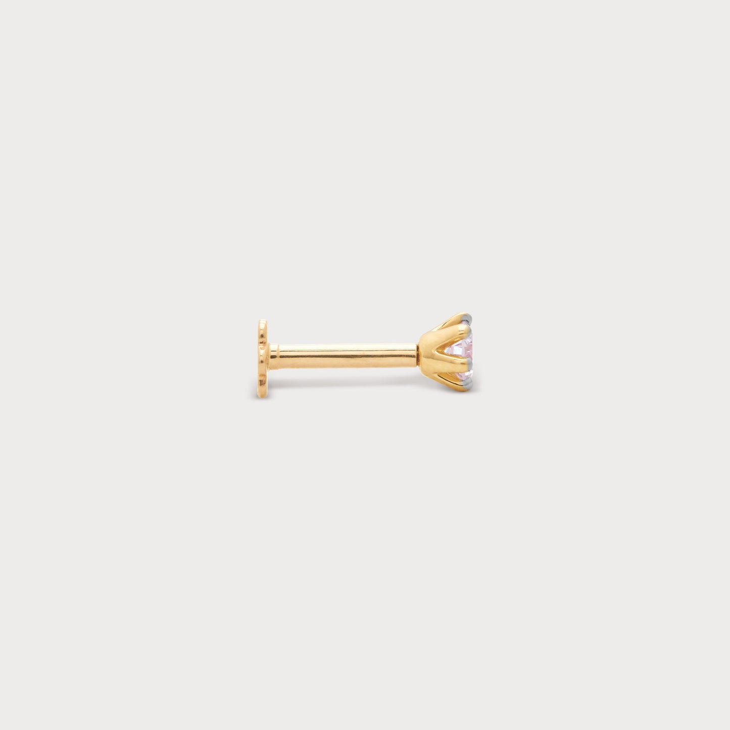 Gold solitaire diamond nose pin with a round brilliant cut diamond in a prong setting, perfect for nose piercings. Elegant diamond jewelry.